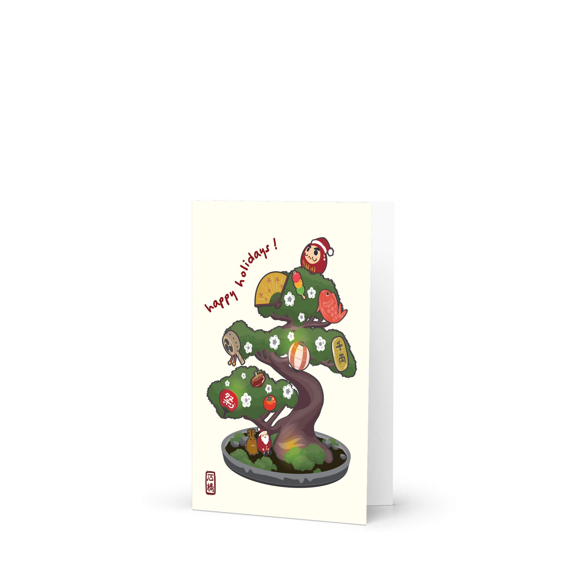 cute japanese christmas card with an Illustration of a bonsai tree decorated with lucky charms, daruma, and red lanterns. Text reads “happy holidays!”