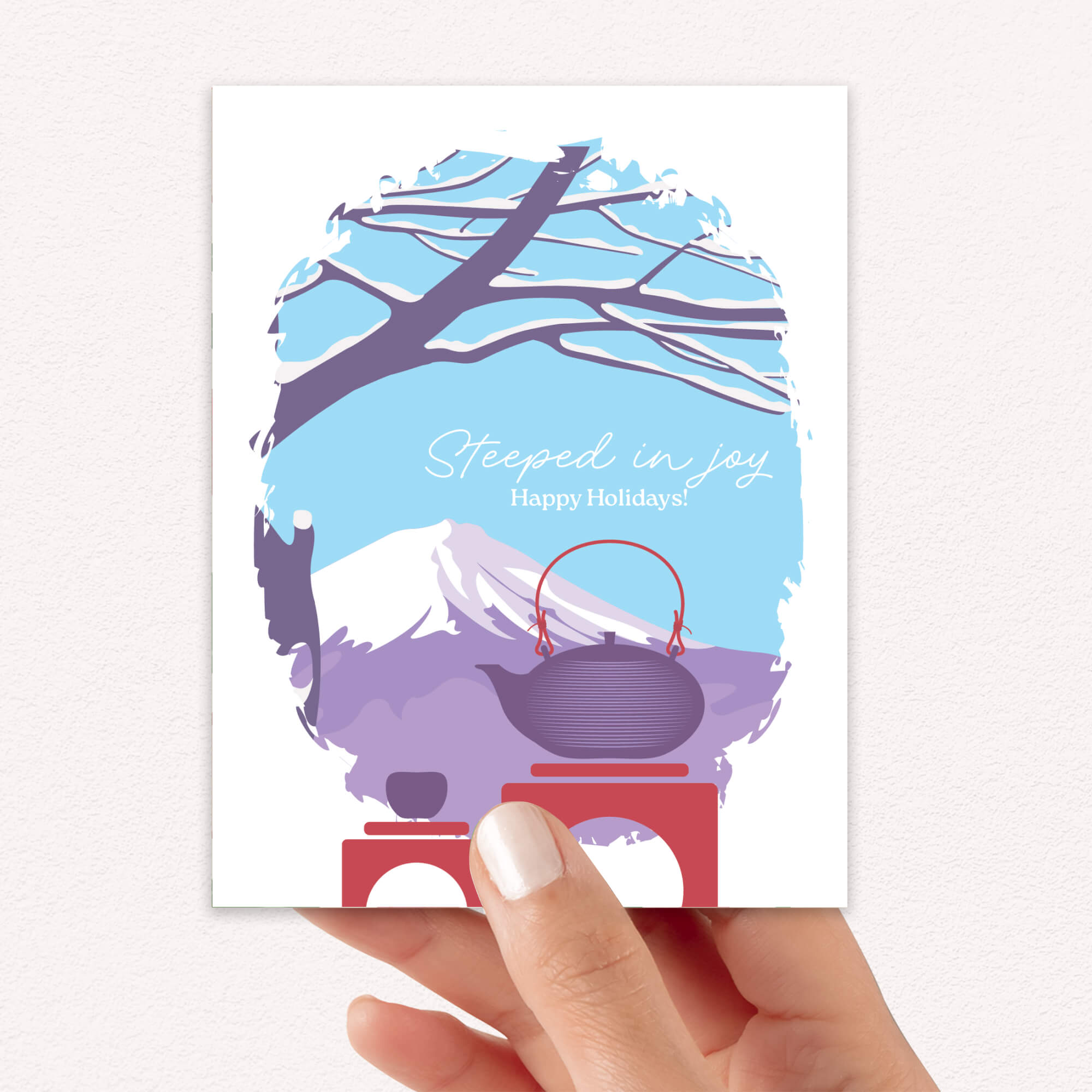 christmas Greeting card with japan's mount fuji winter scene, teapot, and 'Steeped in Joy Happy Holidays' text.