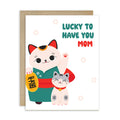 japanese Greeting card with 2 maneki neko lucky cats (mother and child) and text 'Lucky to have you mom' on a white background for a happy mother's day card