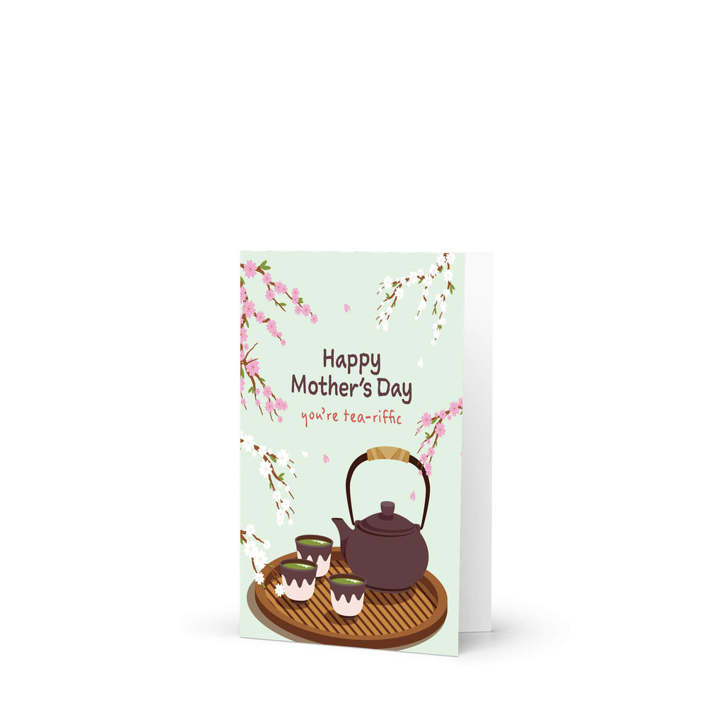 cute Mother's Day card with a brown teapot and cups with green tea and cherry blossom flowers around it with text you're tea-rrific 