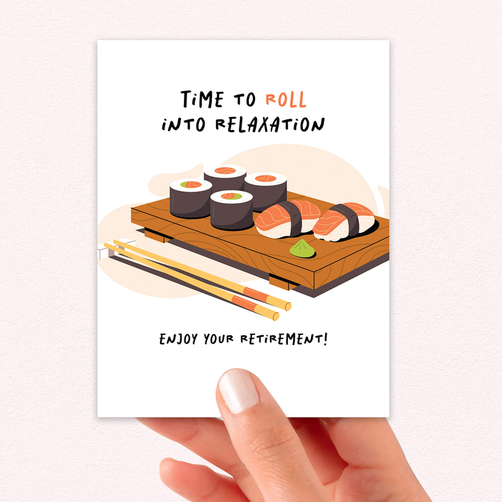 Greeting card with sushi illustration and retirement message, held by a hand.