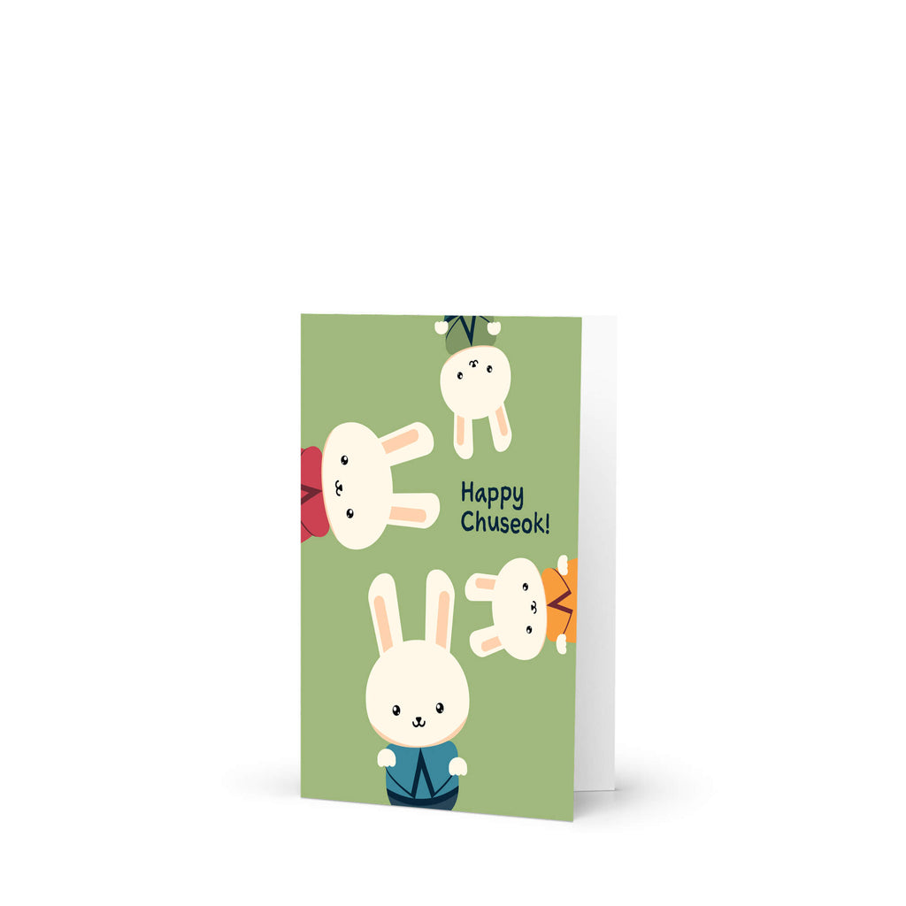 korean harvest Greeting card with cartoon bunnies and 'Happy Chuseok!' text on a green background