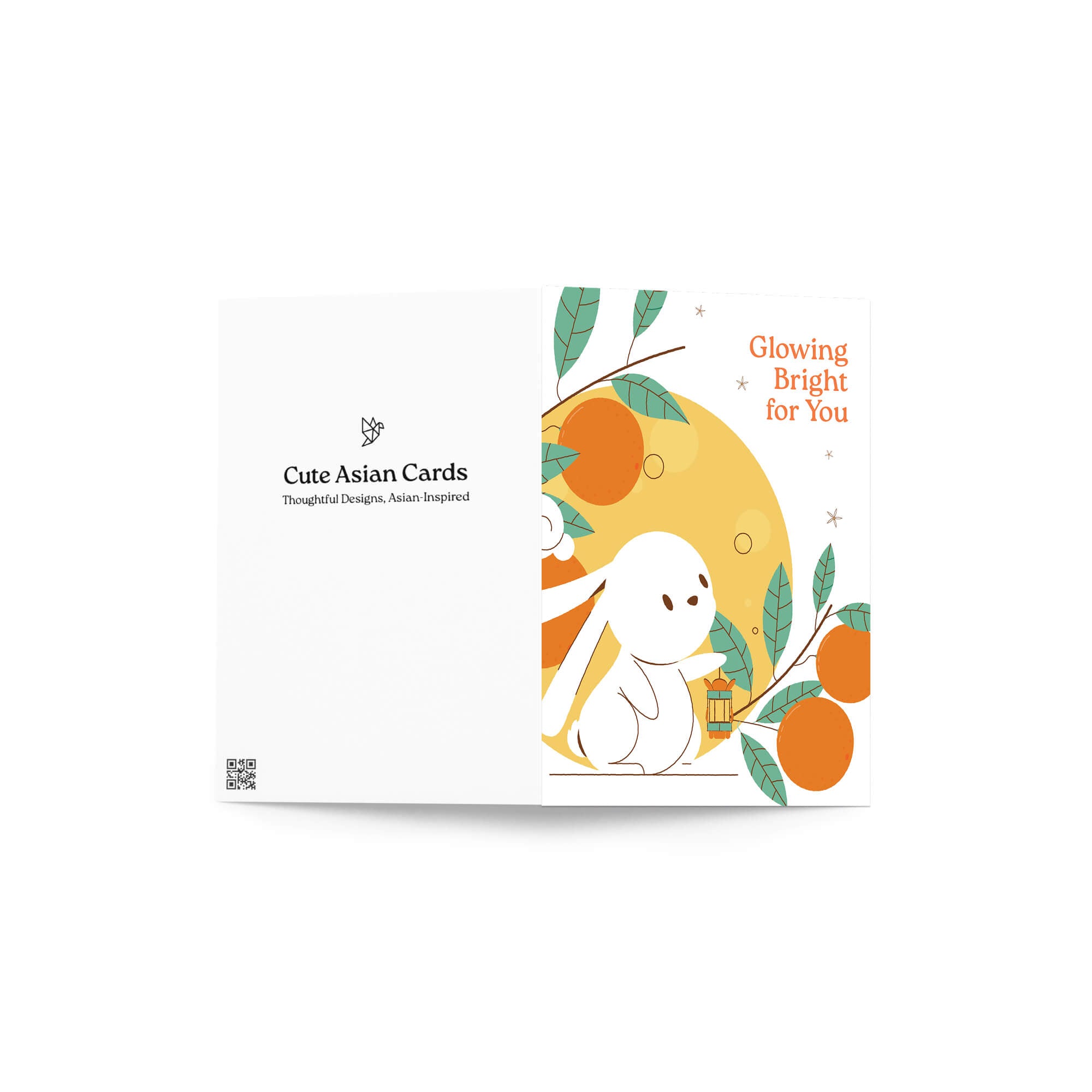 cute asian Greeting card with a white rabbit, orange fruits, and leaves on a white background