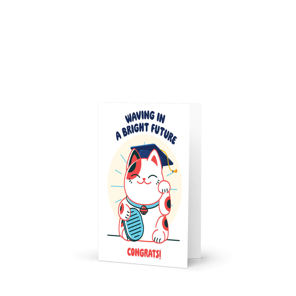 cute graduation card with a japanese lucky cat in a graduation cap and tassel, text 'Waving in a Bright Future' and 'Congrats!' on a white background.