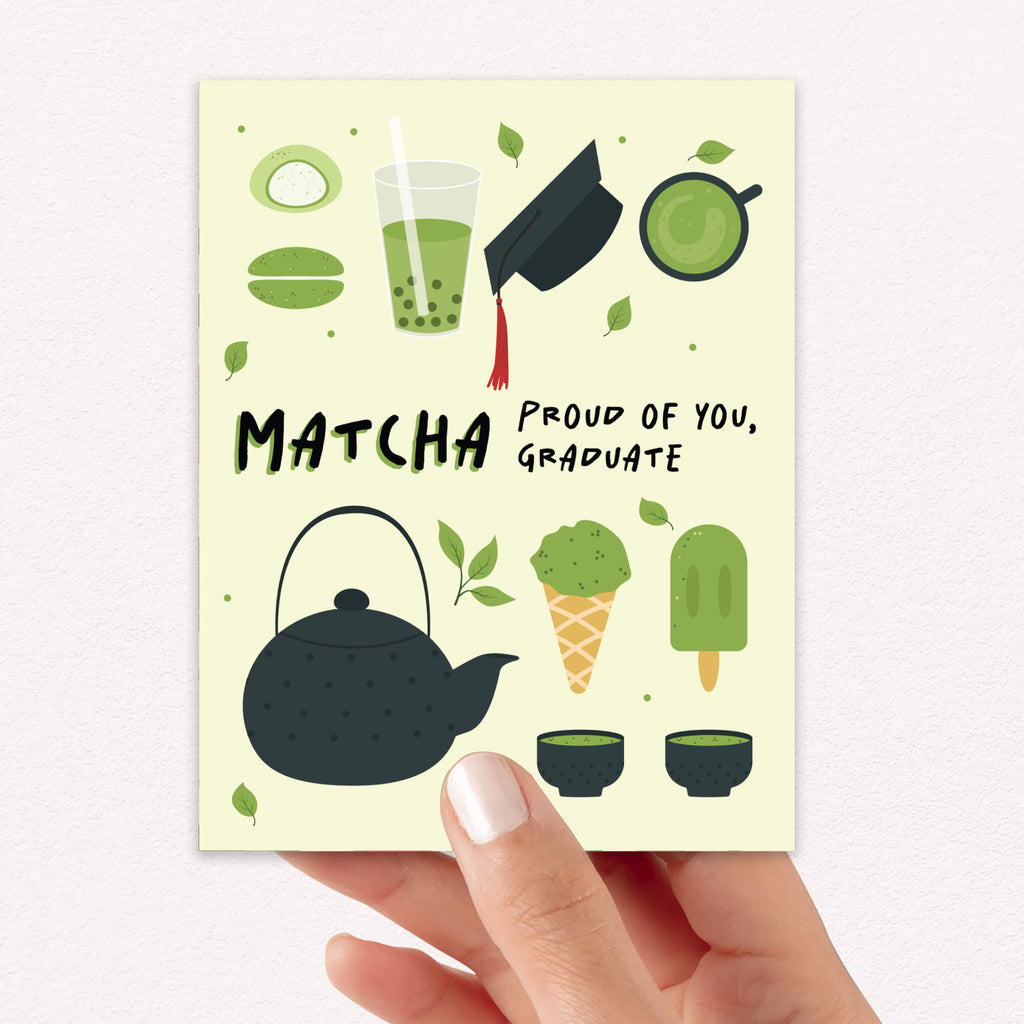 graduation card with japanese matcha green tea illustrations and text 'Matcha Proud of You, Graduate' on a light yellow background.