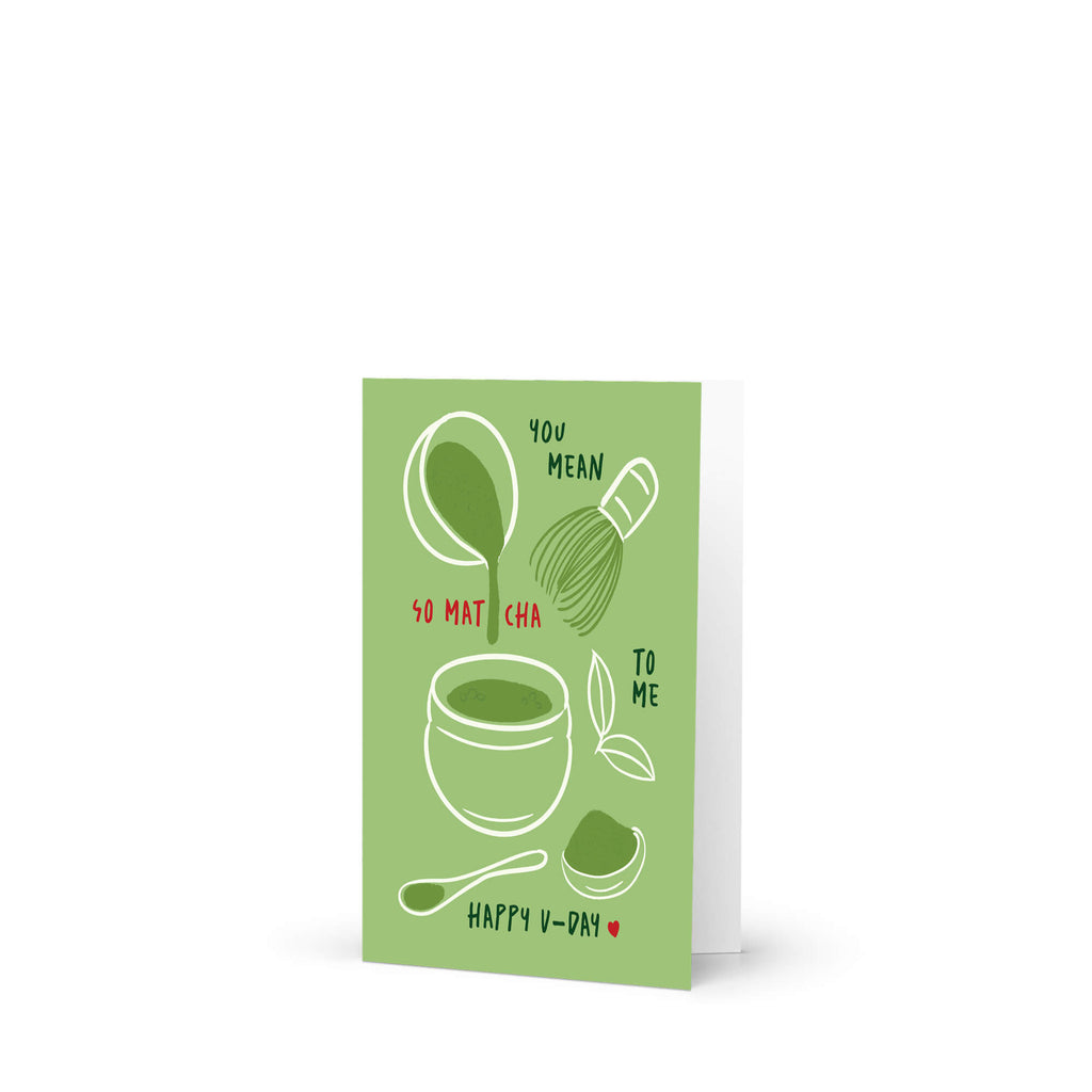 Matcha whisk, bowl, and scoop on green background with “You mean so matcha to me.”
