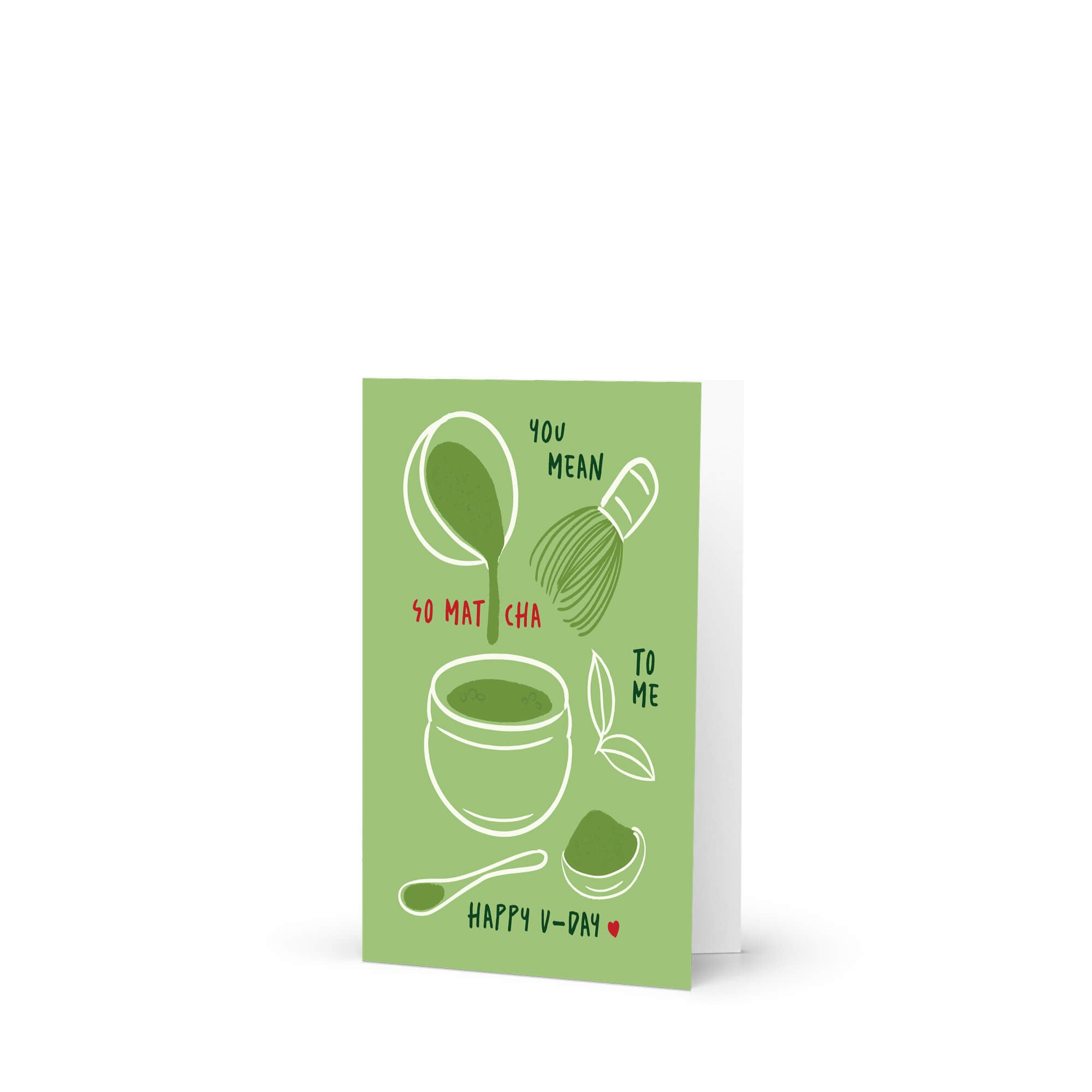 Matcha whisk, bowl, and scoop on green background with “You mean so matcha to me.”