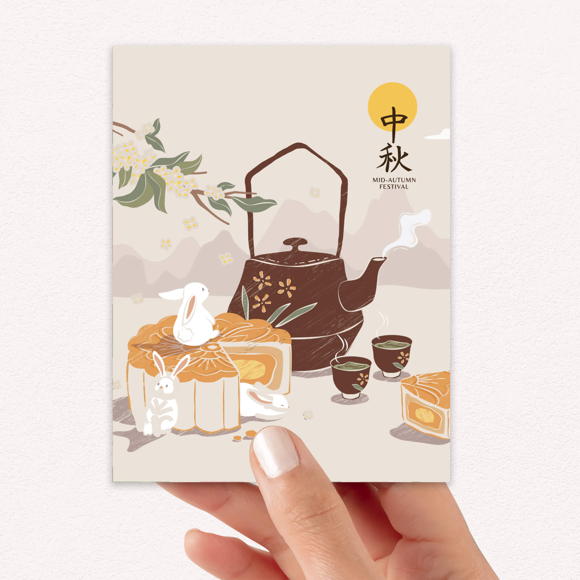 chinese mid autumn Card with illustrations of a teapot, mooncakes, and tea cups, held by a hand.