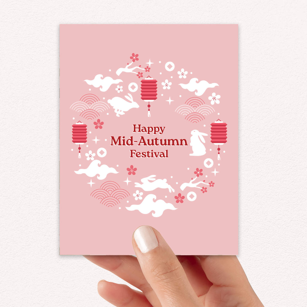 asian greeting Card with 'Happy Mid-Autumn Festival' text and traditional elements on a pink background 