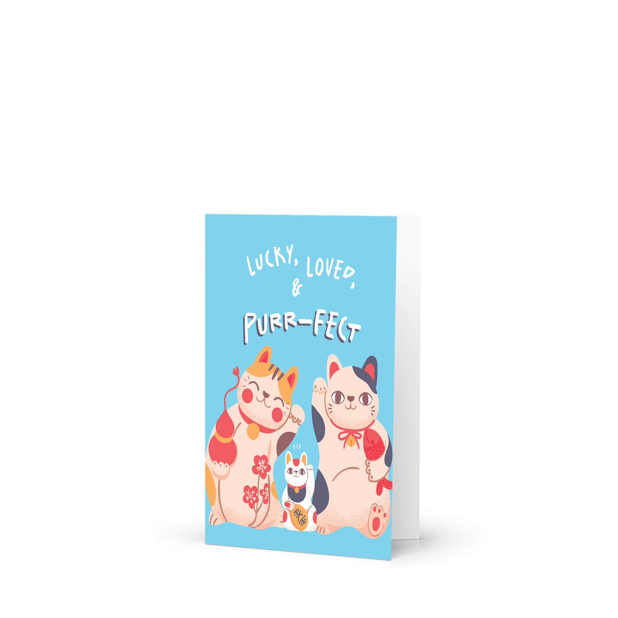 A new baby greeting card with a light blue front cover featuring three cute illustrated cats and the text 'LUCKY, LOVED, PURR-FECT'. The card is shown standing upright against a clean white background.