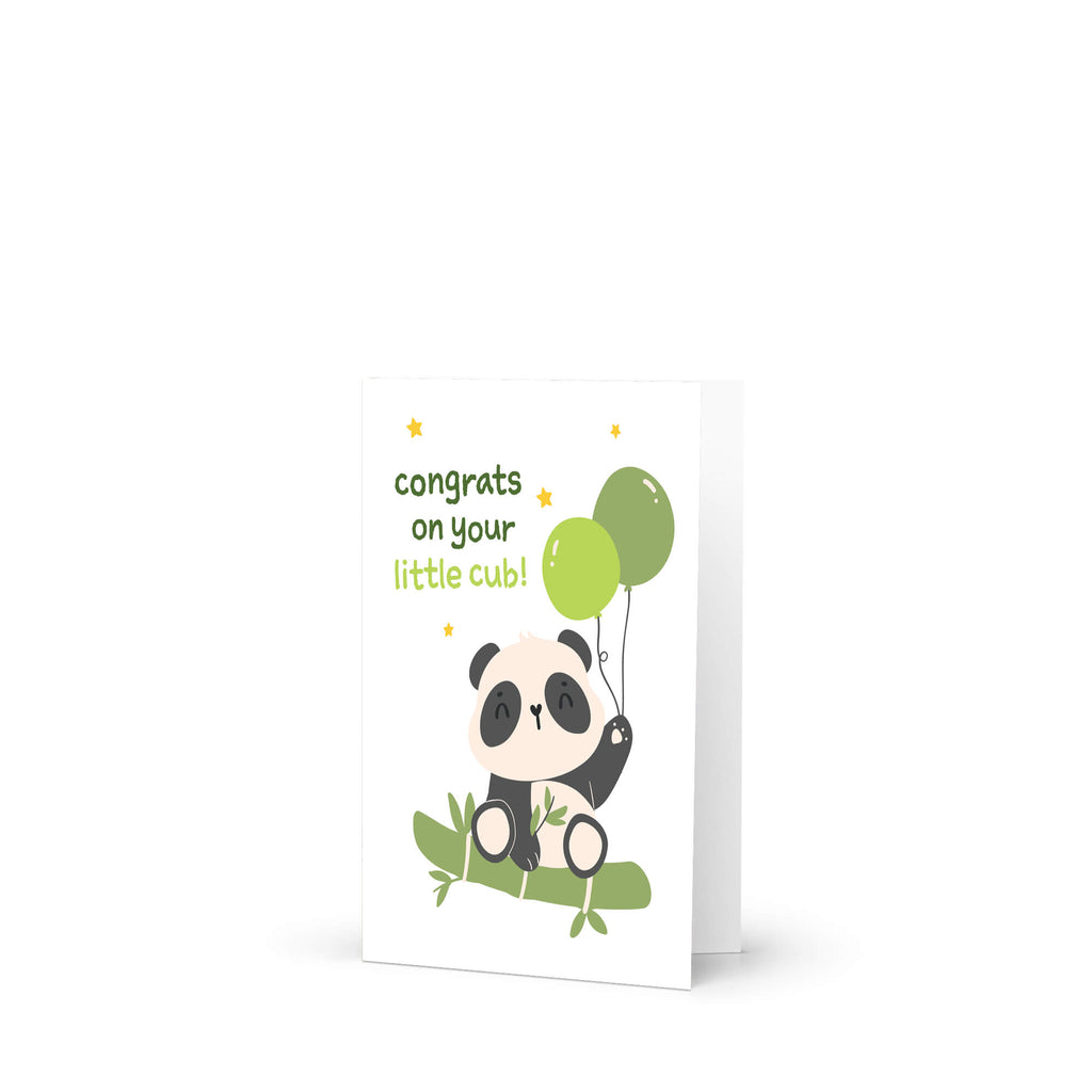 A funny baby shower card featuring a cute cartoon panda holding green balloons, sitting on bamboo with the text 'congrats on your little cub!' in green and yellow lettering.