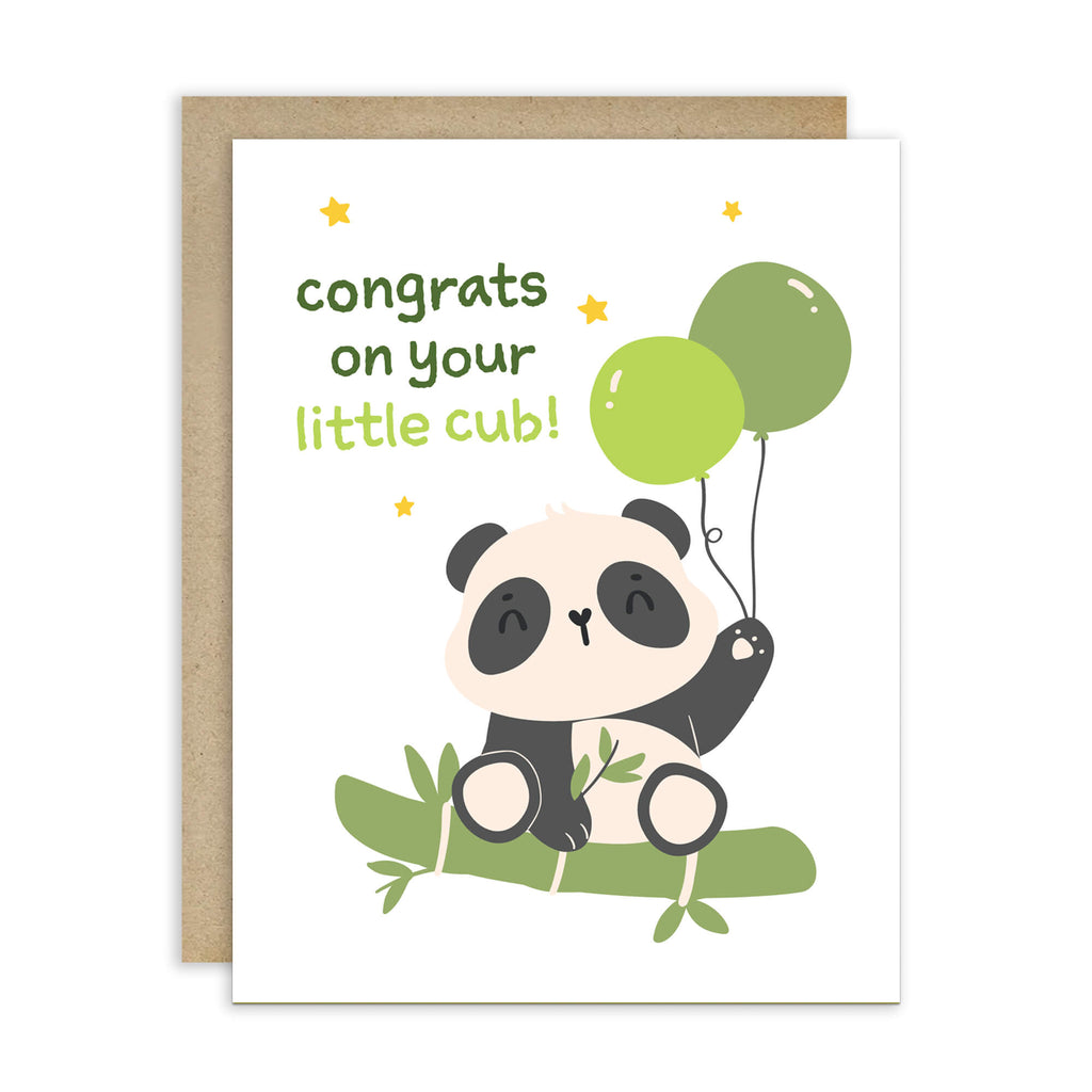 A baby panda congratulations card with a kraft envelope. The white card features a cute cartoon panda sitting on bamboo and holding green balloons, with the text 'congrats on your little cub!' in green and yellow lettering.