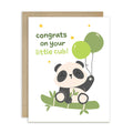 A baby panda congratulations card with a kraft envelope. The white card features a cute cartoon panda sitting on bamboo and holding green balloons, with the text 'congrats on your little cub!' in green and yellow lettering.