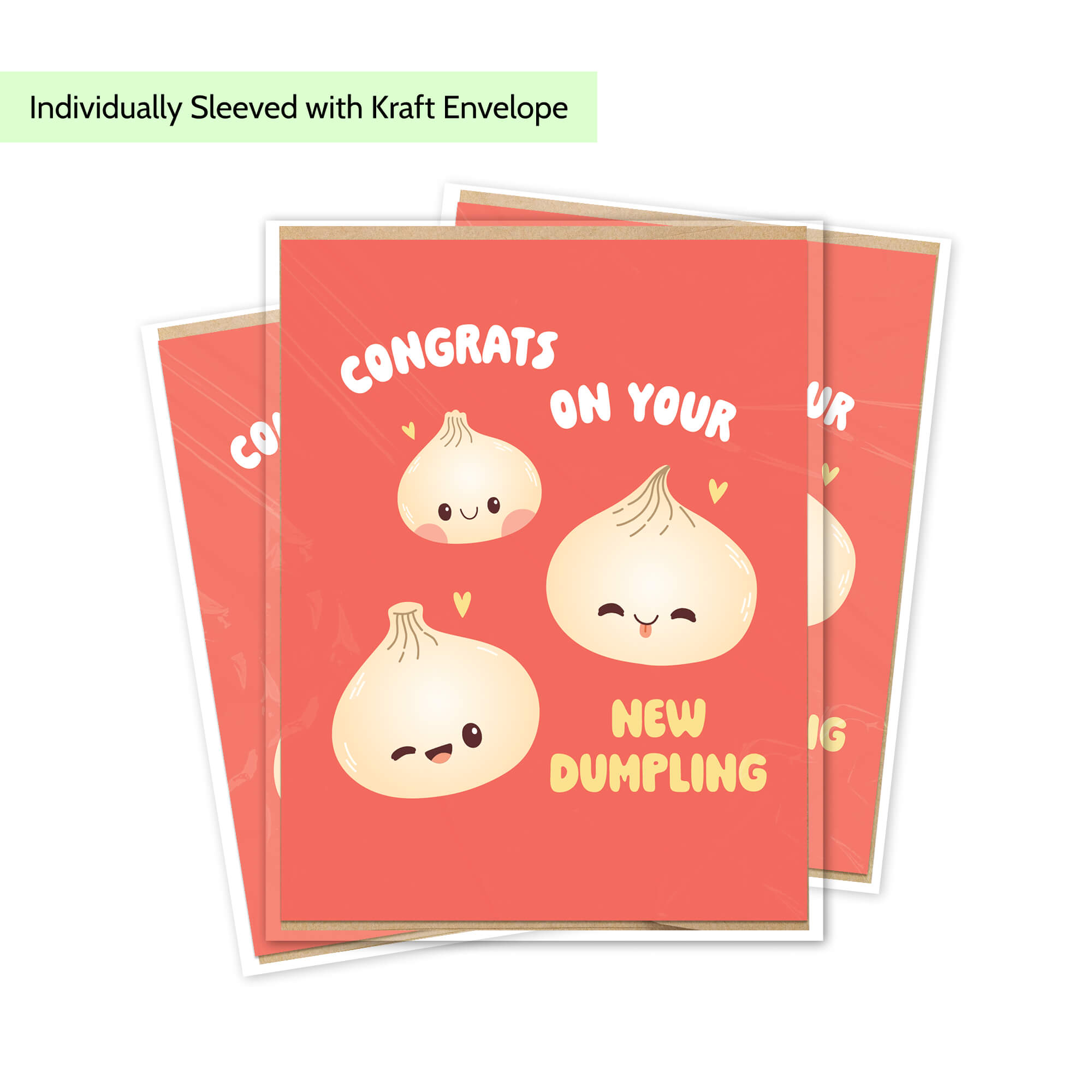 A stack of red greeting cards with cute cartoon dumpling illustrations and the text 'CONGRATS ON YOUR NEW DUMPLING,' shown on a white background with a small note at the top saying 'Individually Sleeved with Kraft Envelope.'.