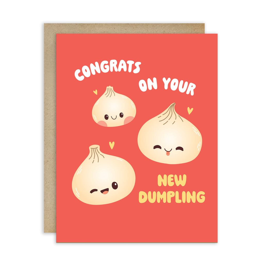 A red greeting card with a kraft envelope behind it, featuring three cute cartoon dumplings and the text 'CONGRATS ON YOUR NEW DUMPLING' on a white background.
