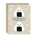 Greeting card with cartoon rice balls and birthday message on a beige background