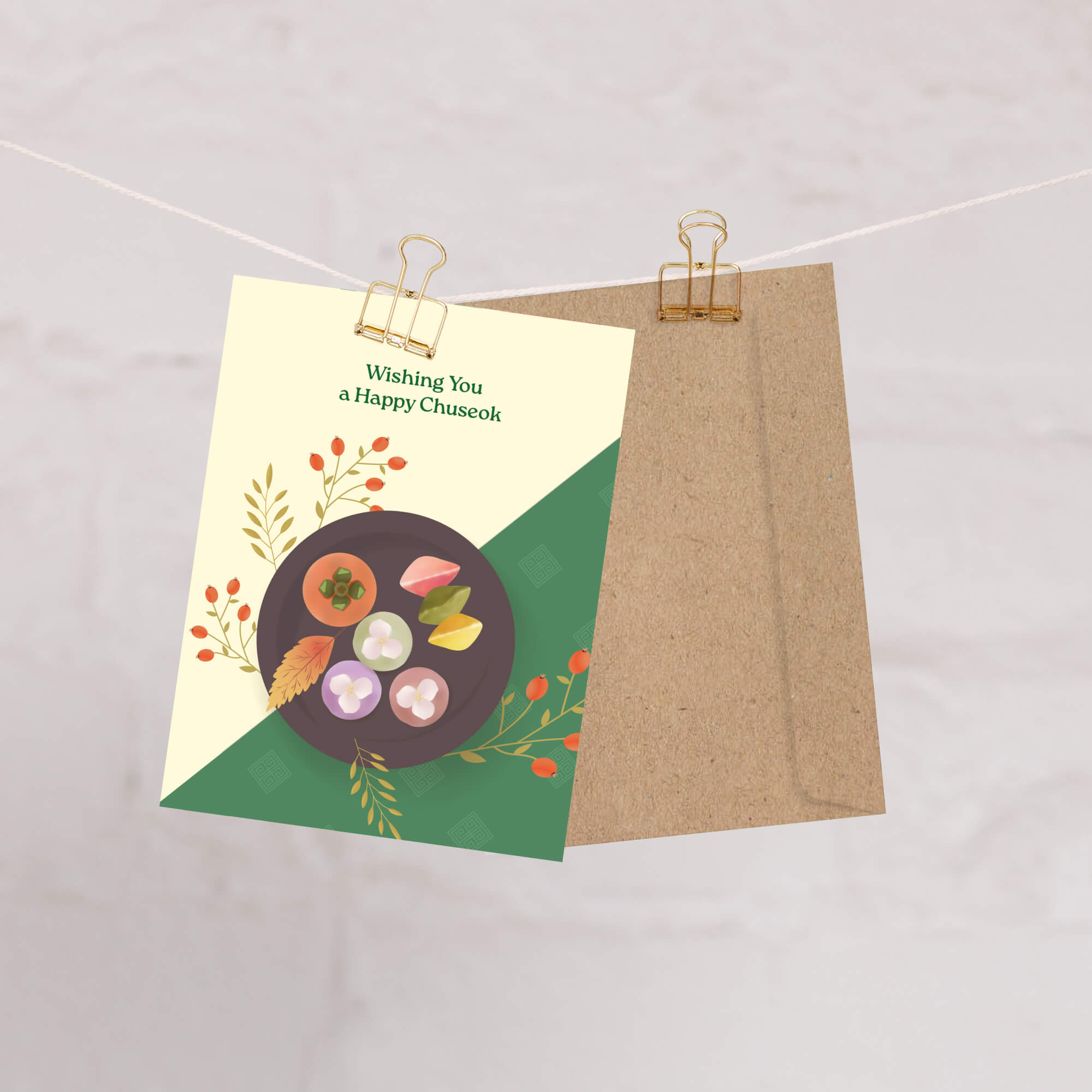 korean Greeting card with a plate of traditional Korean dishes Persimmon, Songpyeon & Hangwa for mid autumn festival  on a green and beige background.