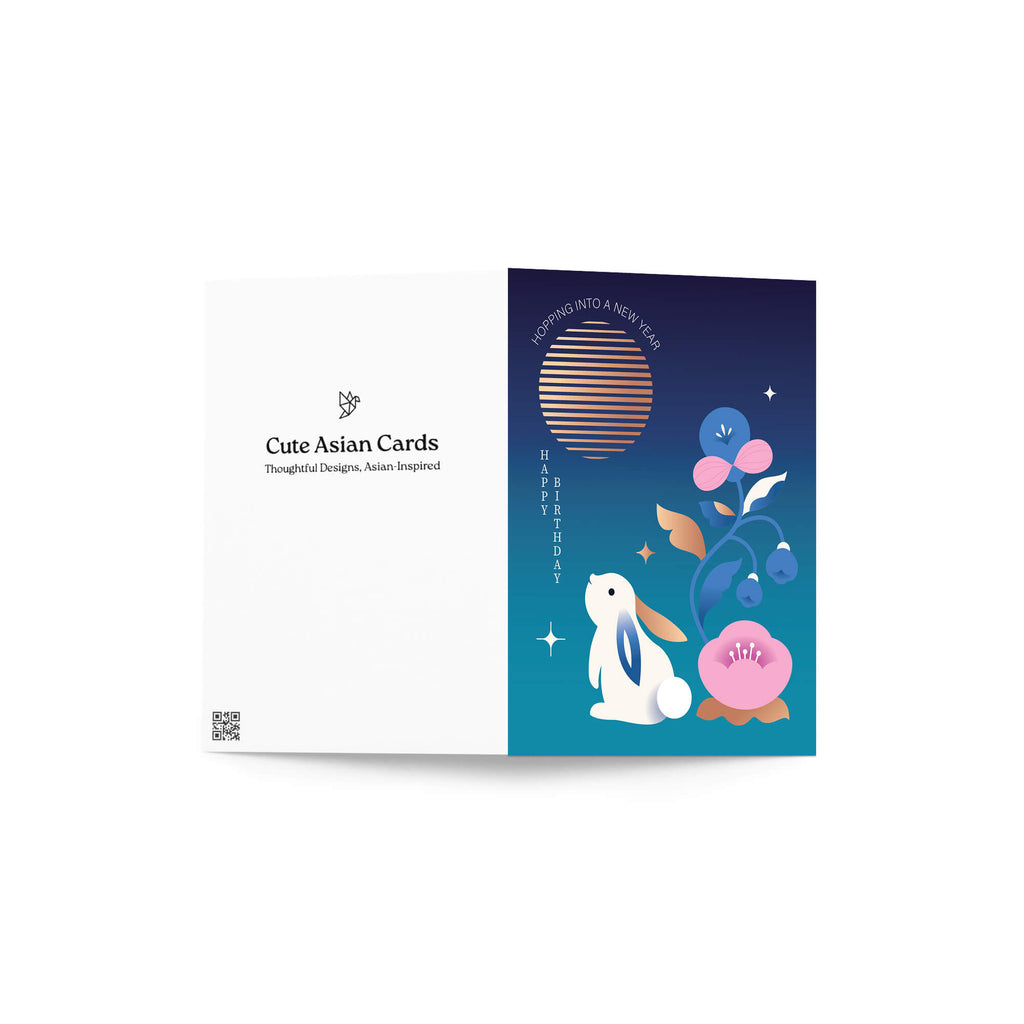 Card with a rabbit and floral design on a blue background, featuring the brand 'Cute Asian Cards'.