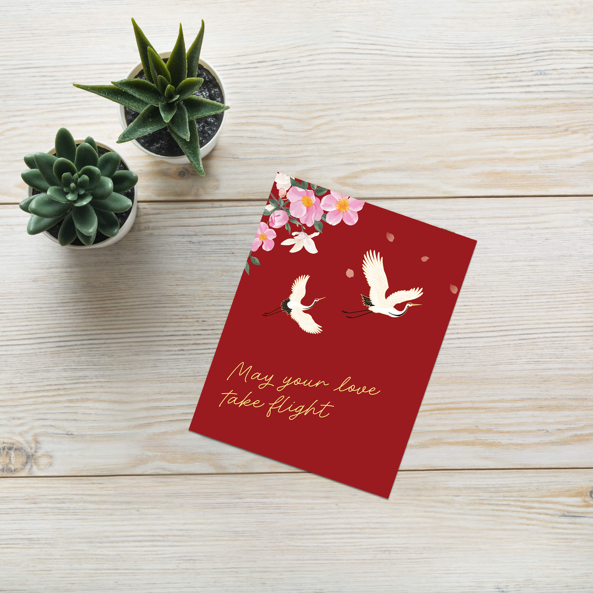 Red wedding chinese vietnamese card with white cranes, pink flowers, and 'May your love take flight' text on a white background