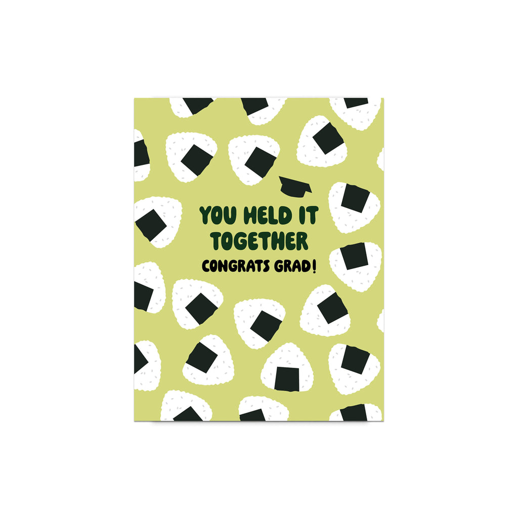 Graduation card with japanese onigiri rice ball pattern and text 'You held it together. Congrats grad!' on a white background.