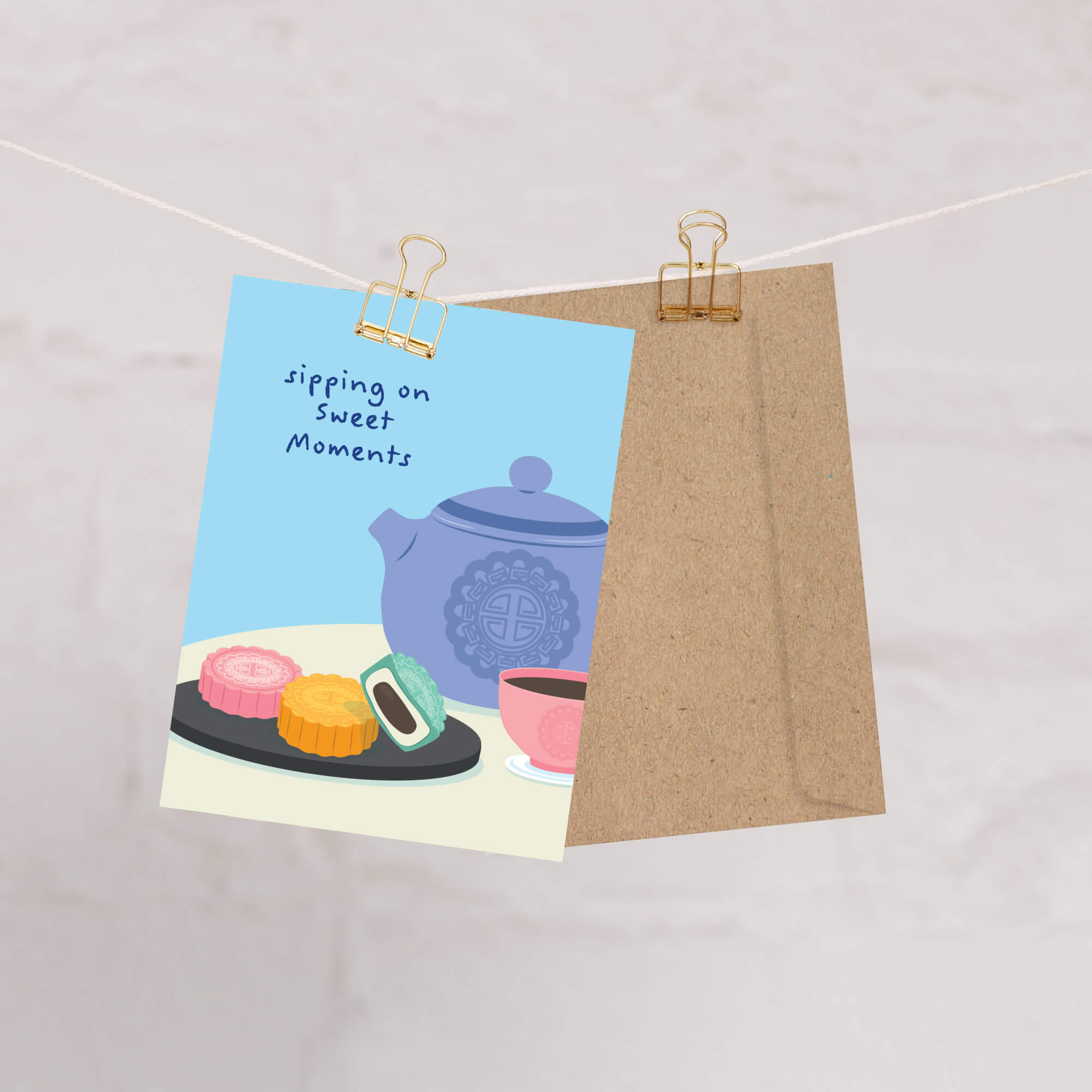 chinese mid autumn festival greeting Card with a blue teapot, tea cup, and pastry mooncakes on a blue background