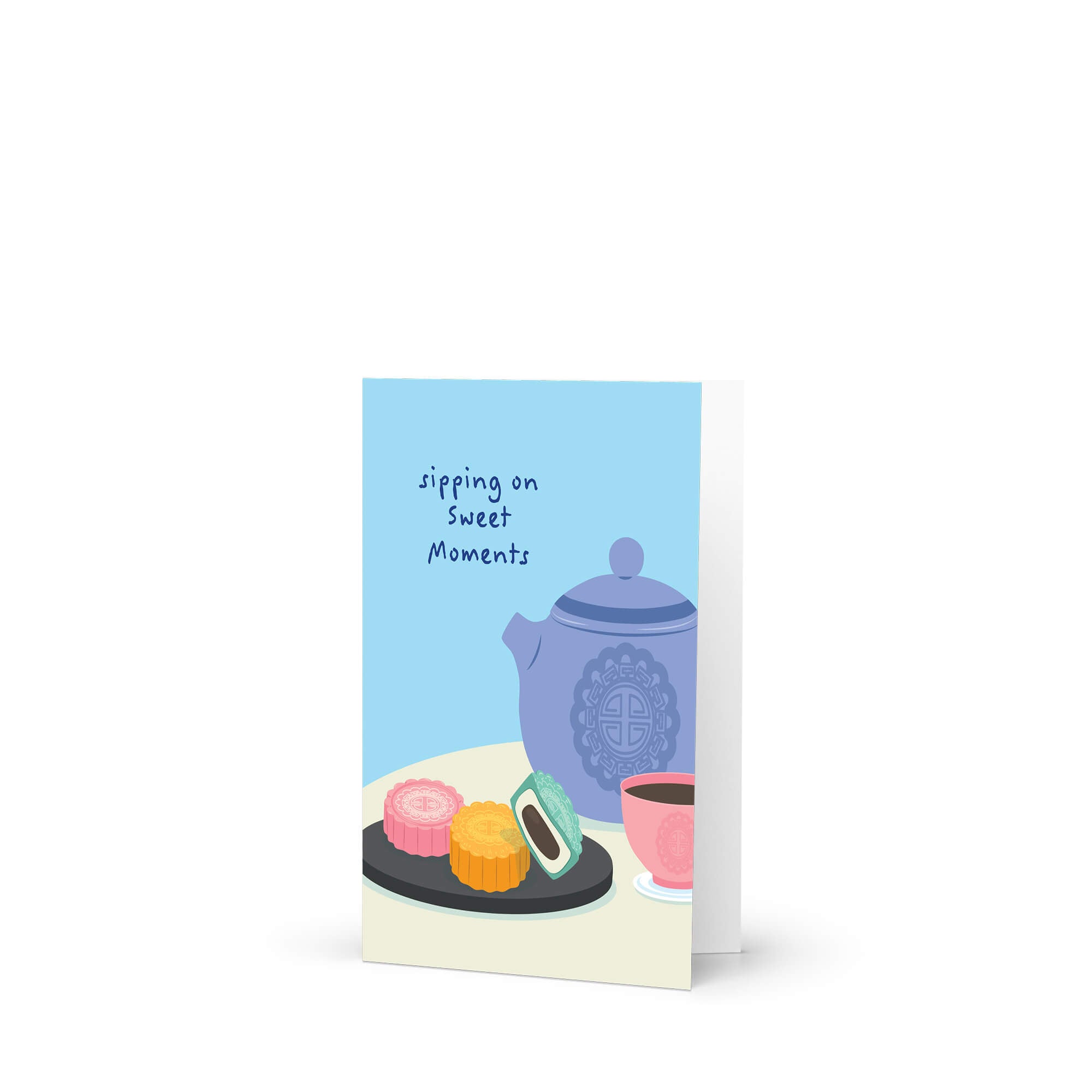 asian greeting Card with a blue teapot, pink teacup, and cookies on a white background with 'sipping on sweet moments' text.