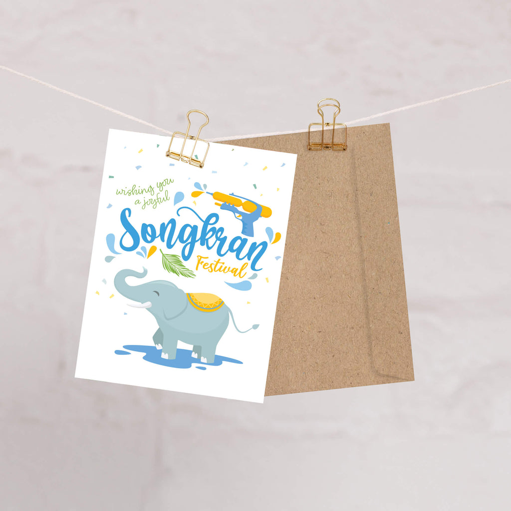 thai new year Greeting card with an elephant and Songkran Festival text on a white background