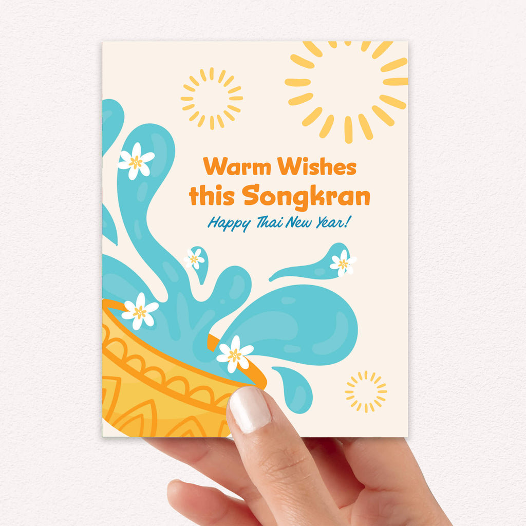 thai new year Greeting card with water splashes and text for Songkran celebration on a white background