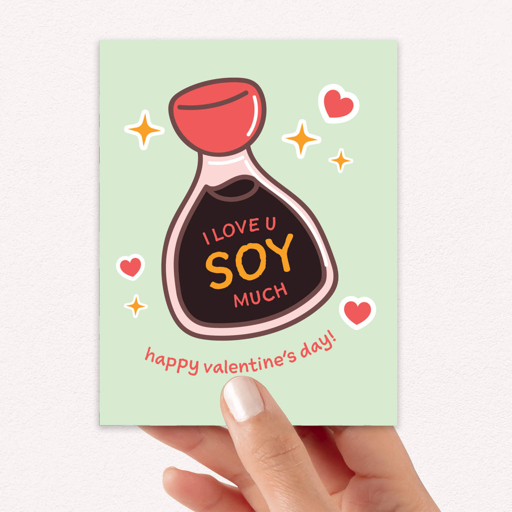 Smiling soy sauce bottle on mint with hearts; label says “I love u soy much.”