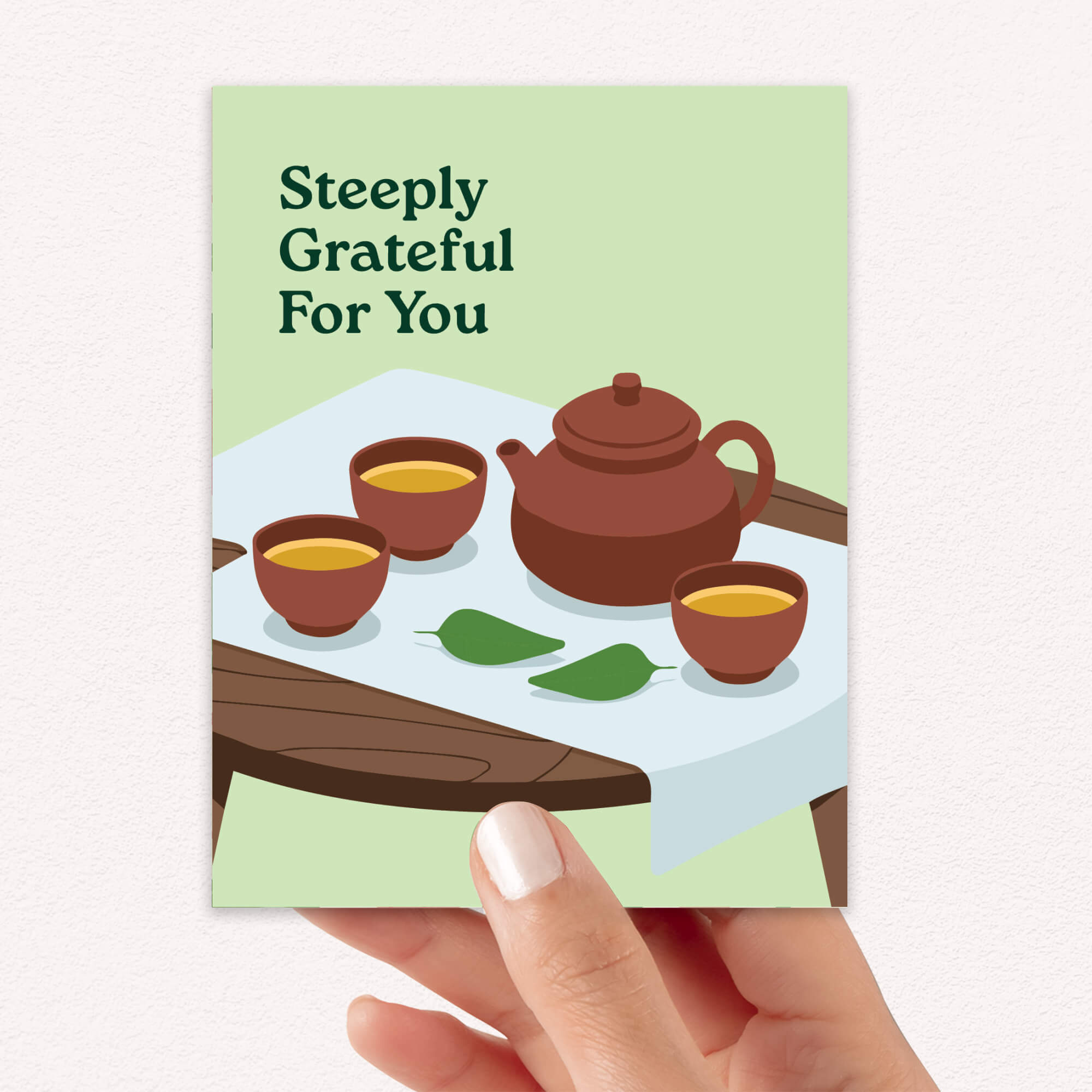 asian Greeting card with a chinese teapot and cups illustration and 'Steeply Grateful For You' text.