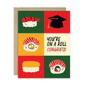 graduation card with sushi illustrations and a graduation cap, featuring the text 'You're on a roll congrats!'