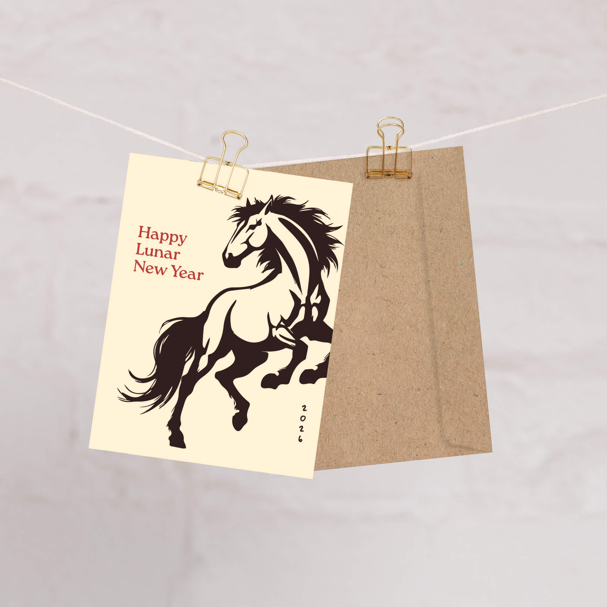 Card with horse illustration and 'Happy Lunar New Year' text on beige paper, held by a clothespin against a light background.