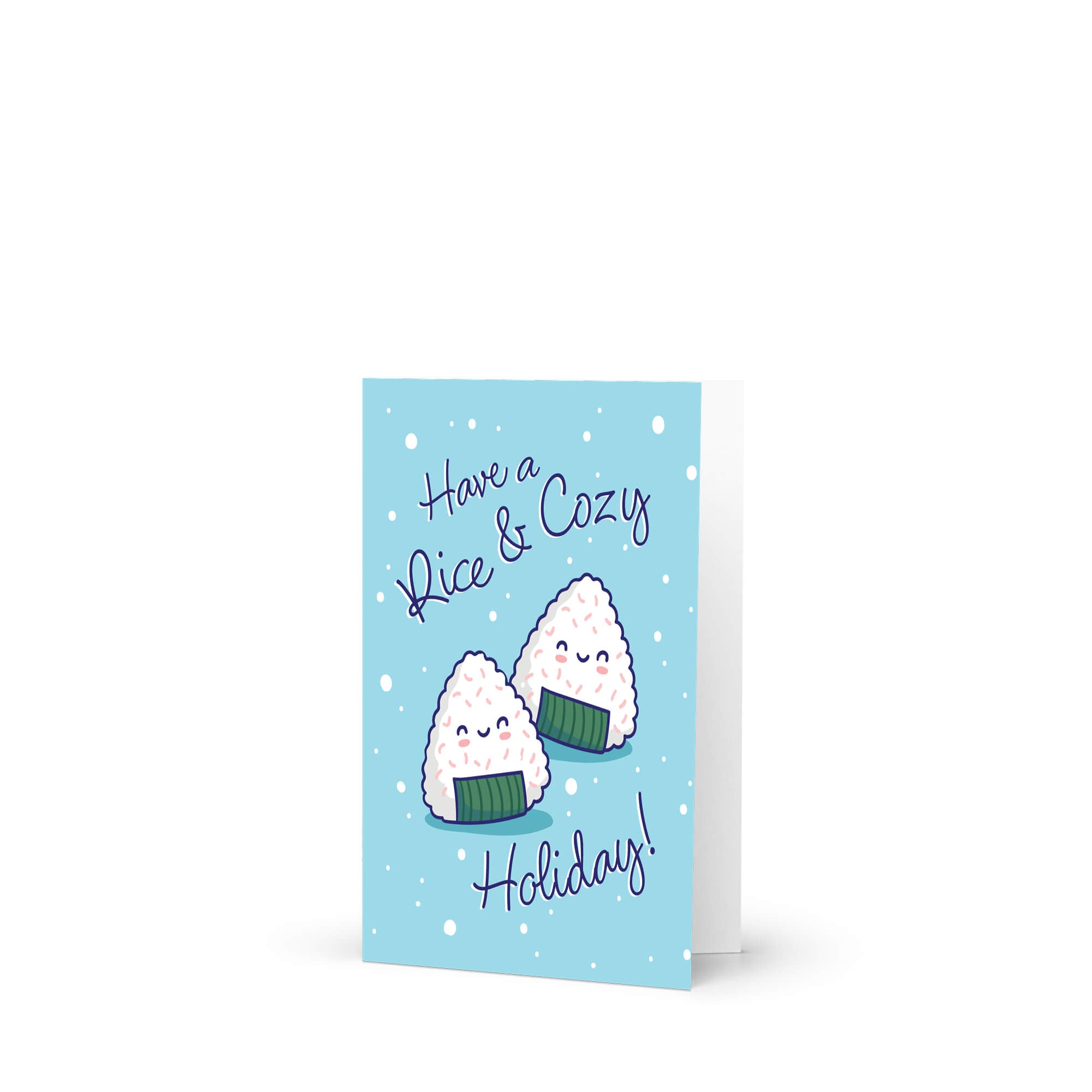 unique christmas card with Two smiling onigiri (japanese rice ball snacks) on snowy blue with text “Have a Rice & Cozy Holiday.”