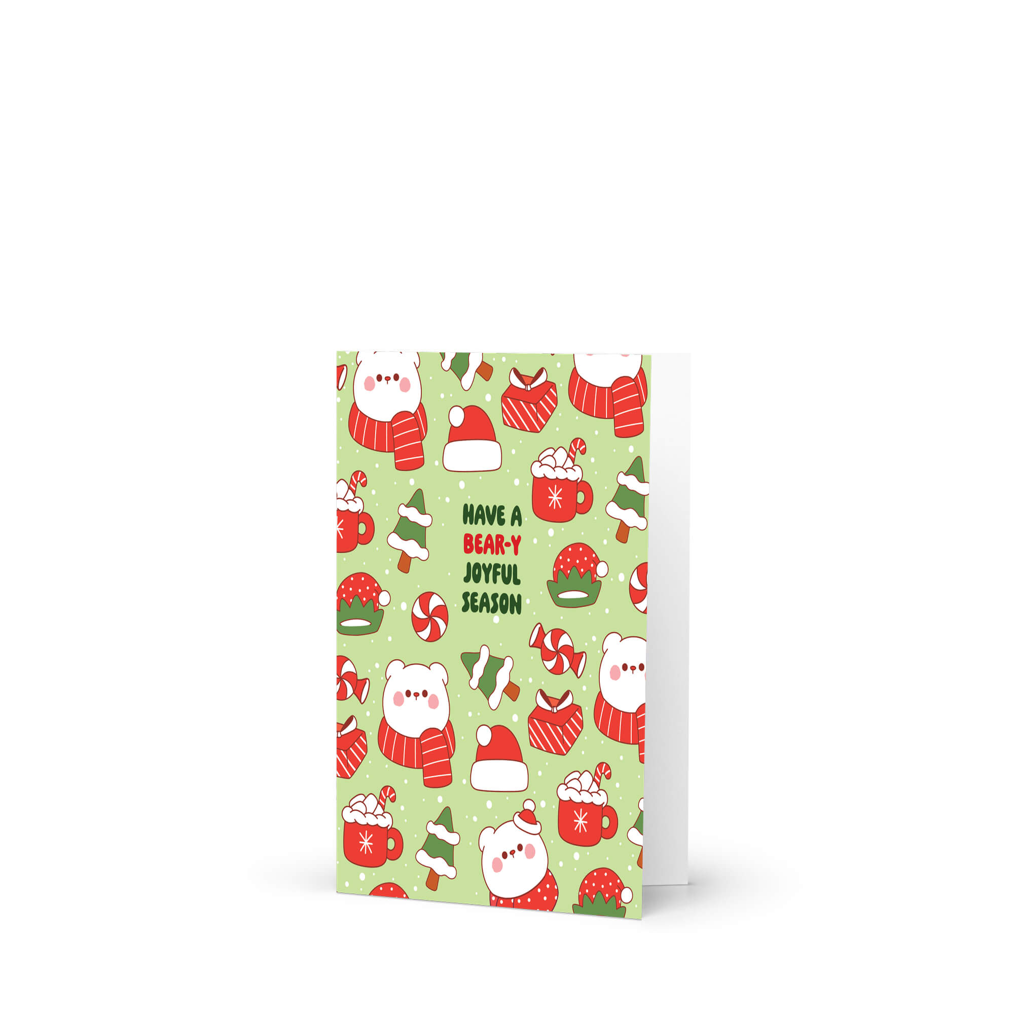 unique Christmas card with white polar bear in red scarf and santa hat and holiday elements on a green background with text "have a bear-y joyful season"