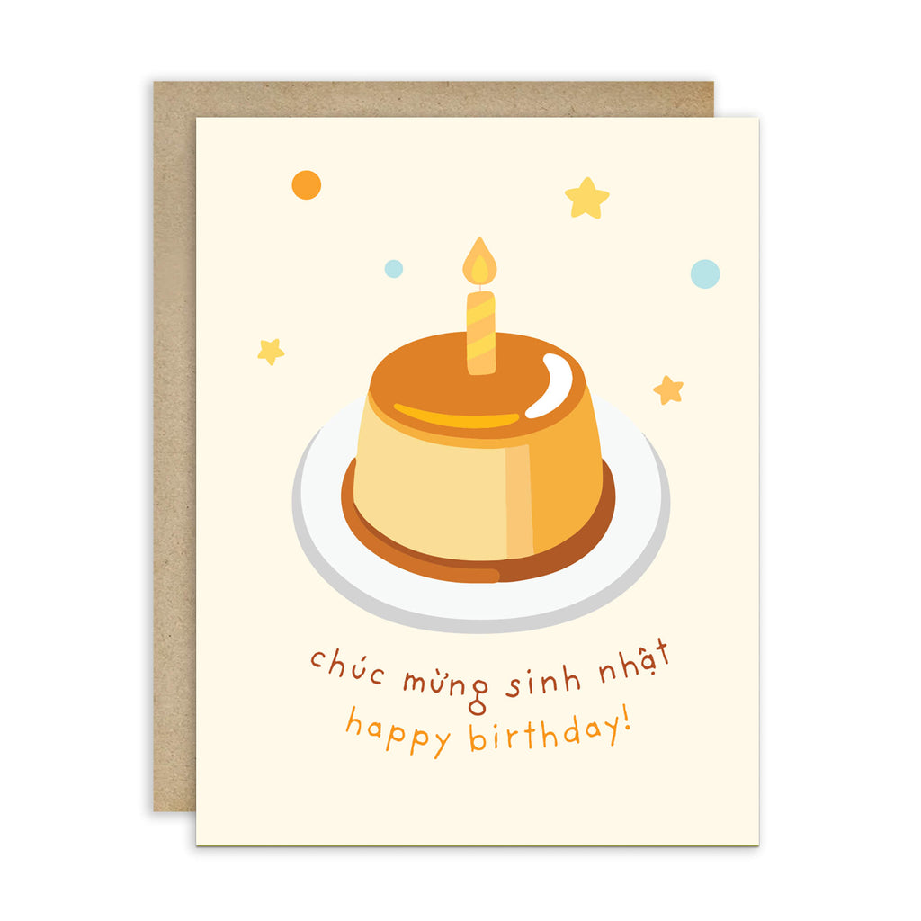A Vietnamese birthday card with a kraft envelope, featuring an illustration of a caramel-colored flan or custard dessert on a white plate with a single candle, surrounded by small stars and dots, with the text 'Đơch mưng sinh nhát happy birthday!' in brown and orange lettering.