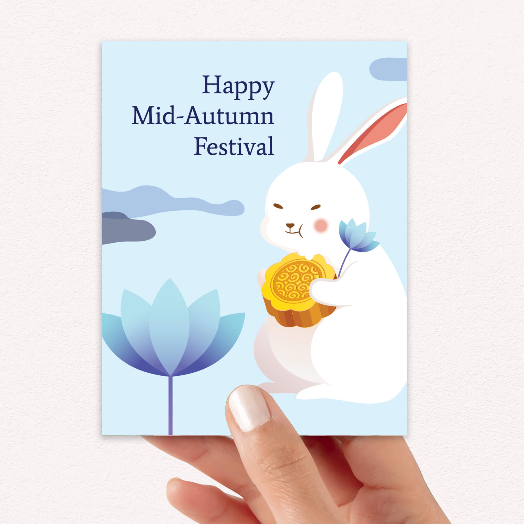 chinese asian Greeting card with a white rabbit holding a mooncake and lotus flower, text 'Happy Mid-Autumn Festival', on a light blue background.