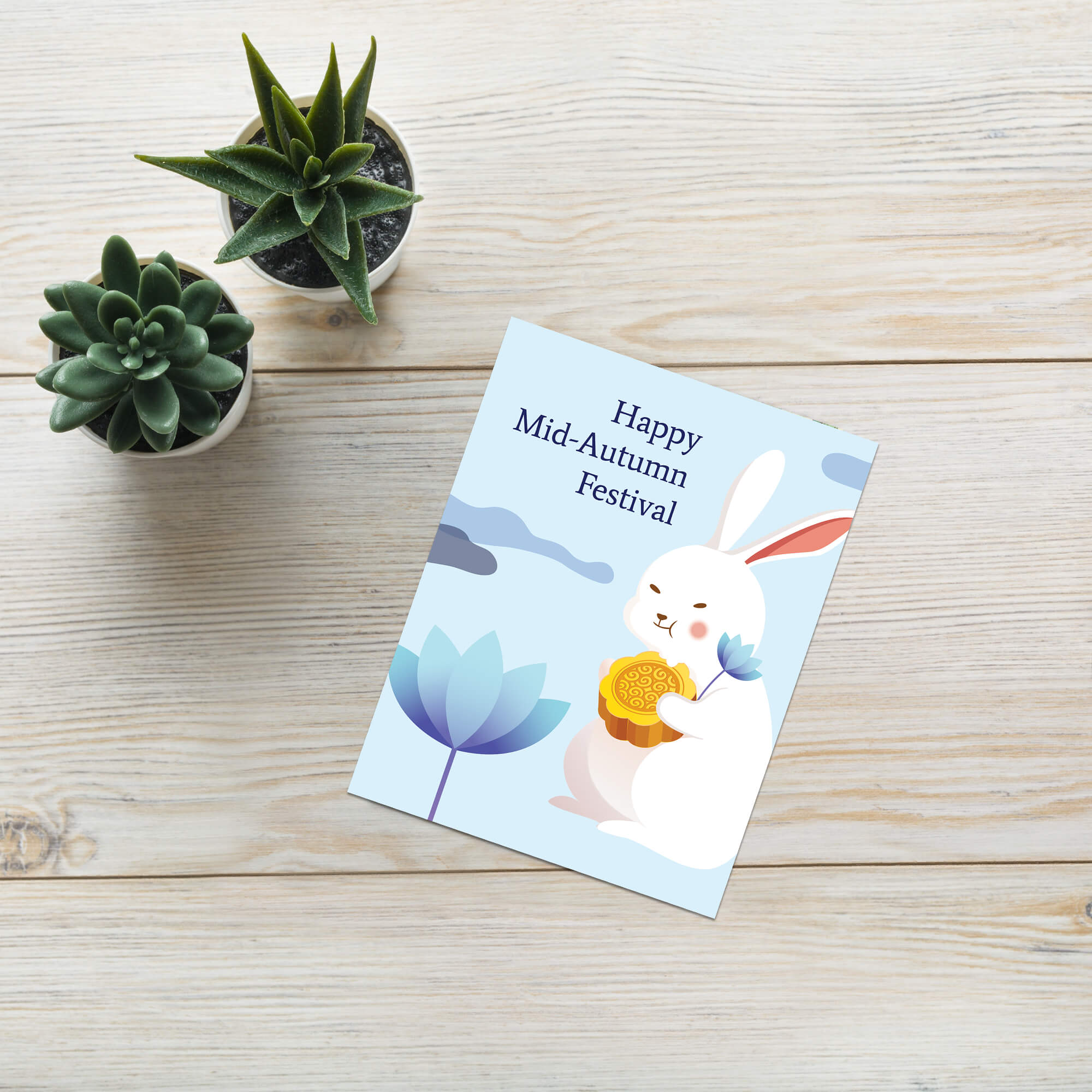 chinese asian Greeting card with a white rabbit holding a mooncake and lotus flower, text 'Happy Mid-Autumn Festival', on a light blue background.